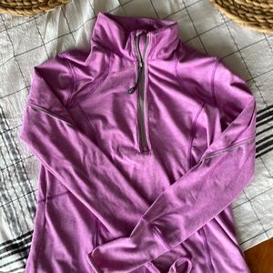 Tangerine quarter zip pull on long sleeve jacket .  Purple/gray stripe